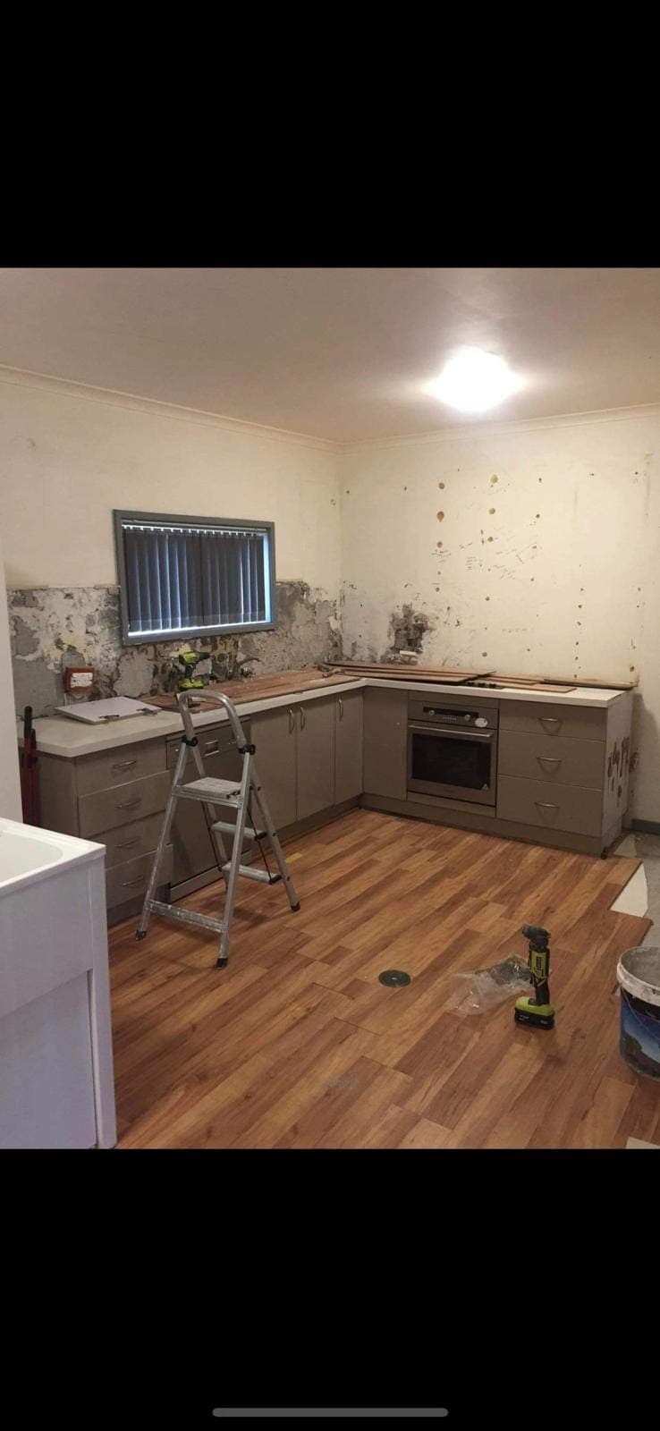 Renovation photo: kitchen renovation with cabinets and stepladder