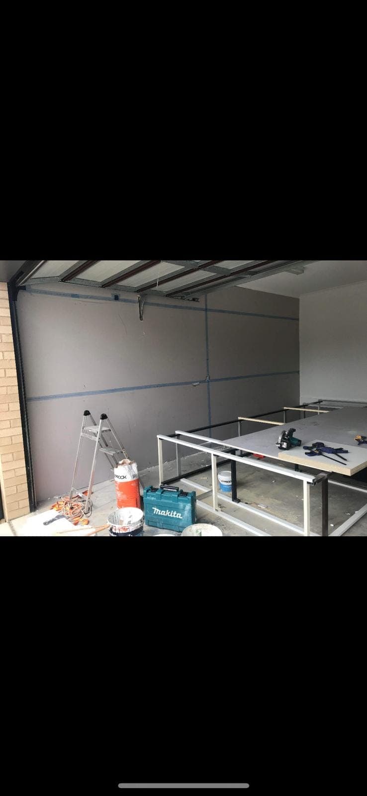 Renovation photo: workshop interior with makita tools and ladder