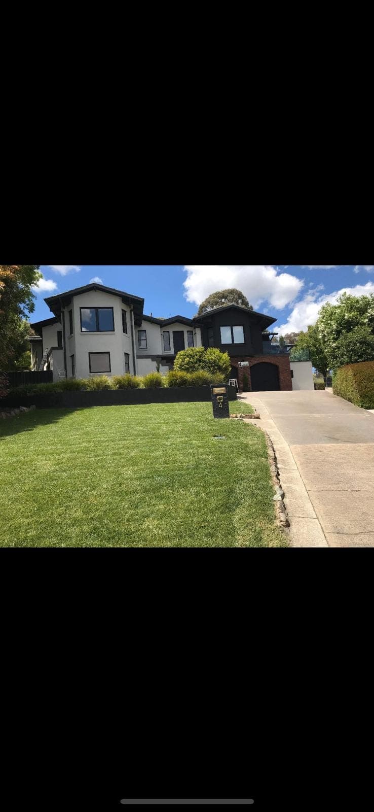 Renovation photo: two storey house exterior with front lawn