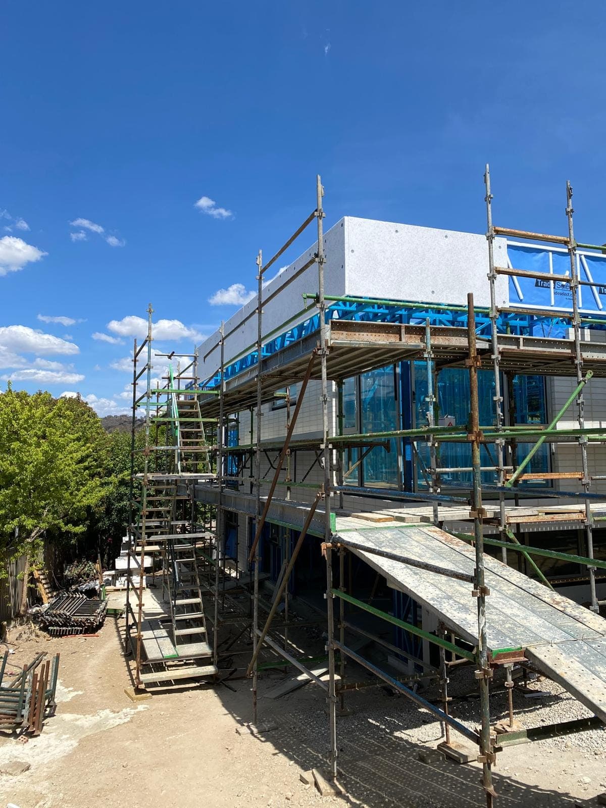 Renovation photo: house under construction with scaffolding