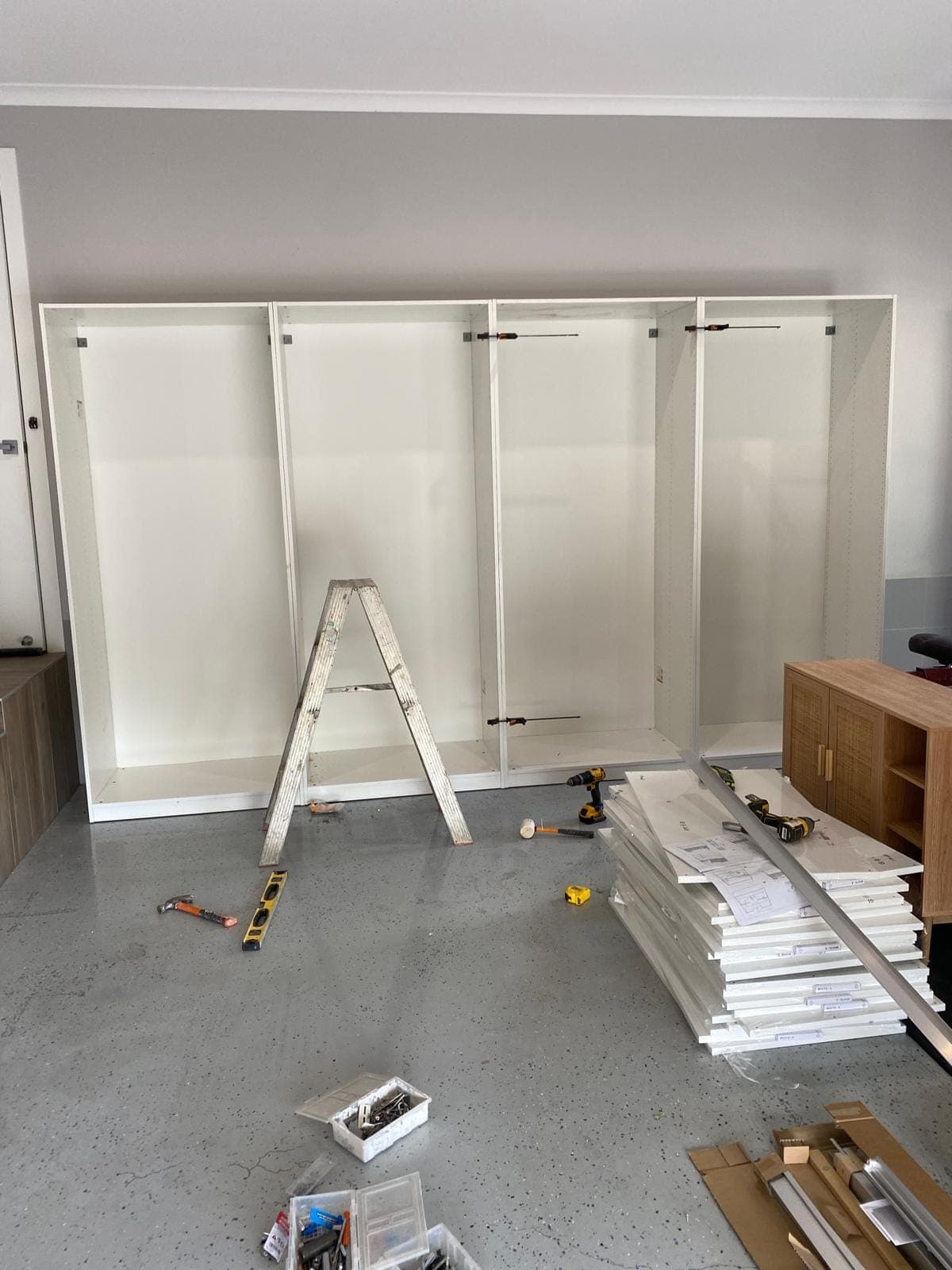 Renovation photo: white wardrobe with sliding doors installed