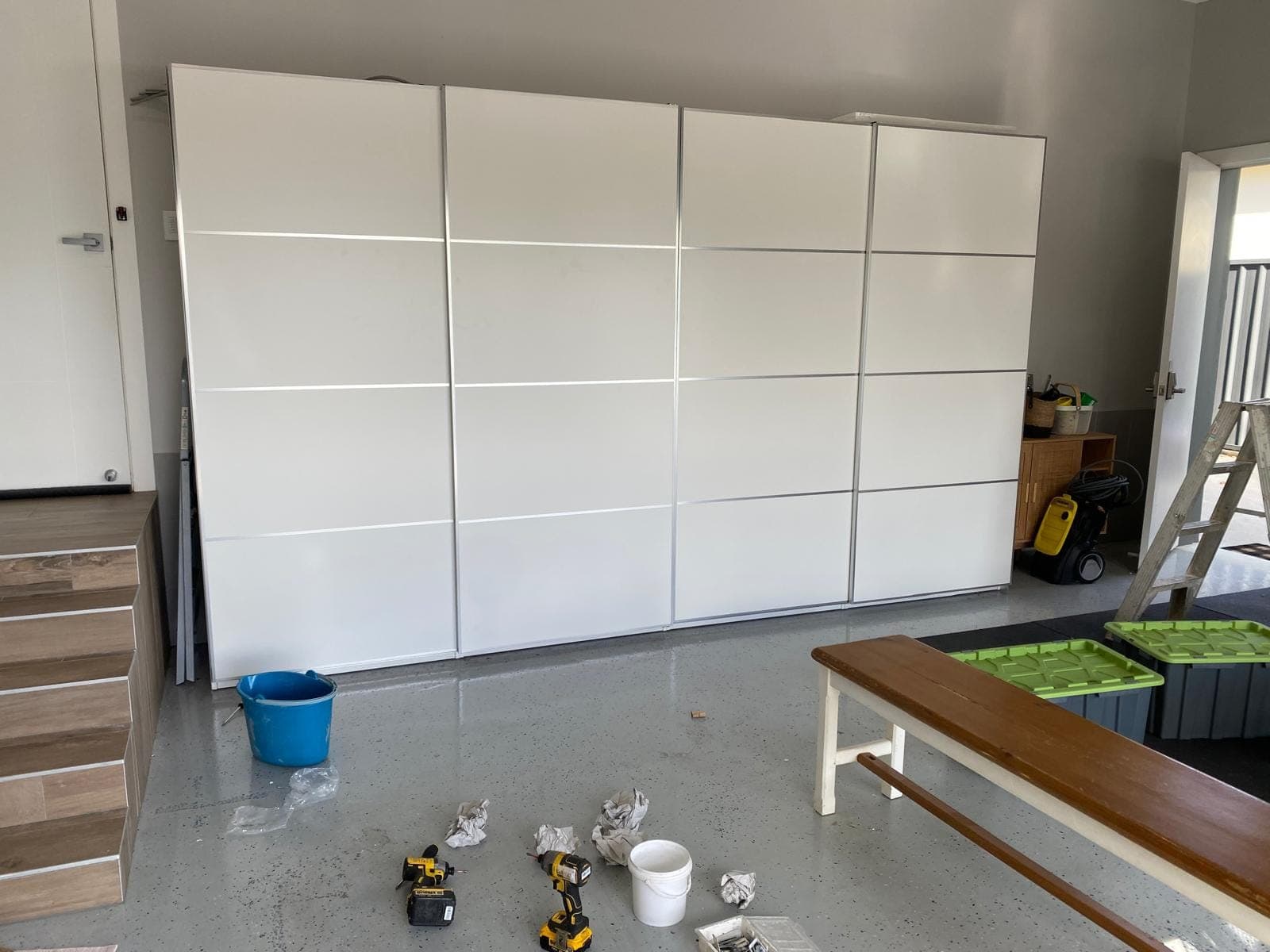 Renovation photo: white built in cabinets with bench seat