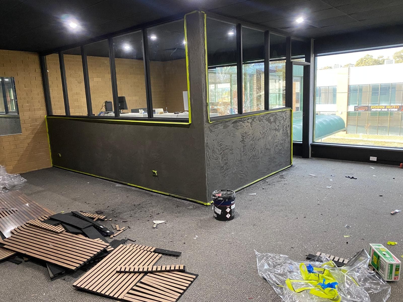 Renovation photo: reception counter with grey panels installed